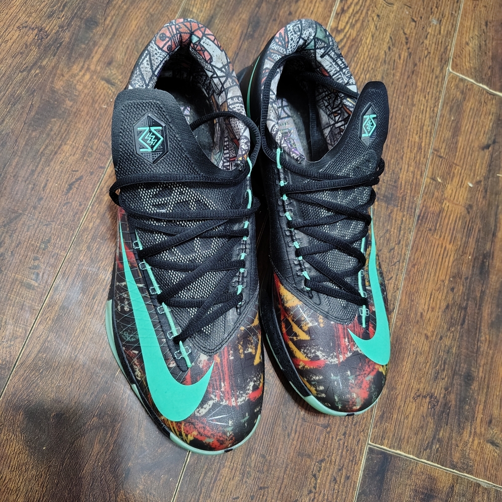 Nike Athletic Shoes with Black and Teal Accents